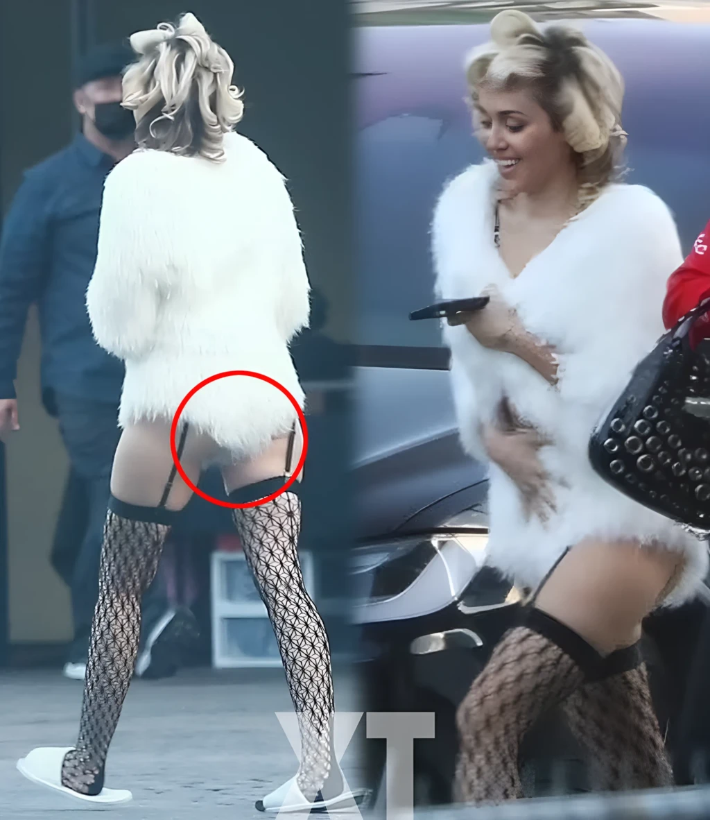 (X) Miley Cyrus sports a furry white coat with sexy black fishnet ...